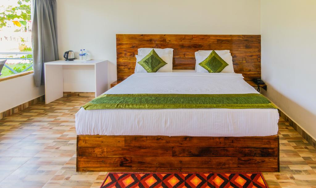 treebo lands end beach resort morjim