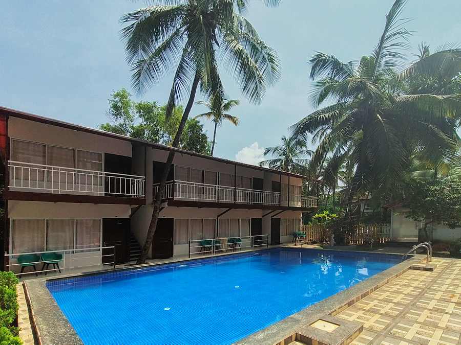 beach walk resort morjim by feather touch