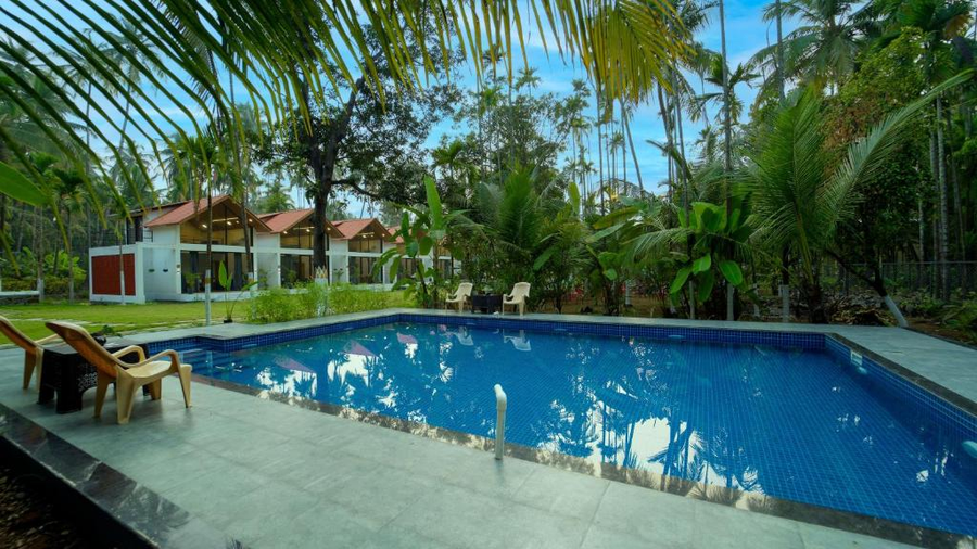 the enchanted nest luxurious cottages near akshi beach